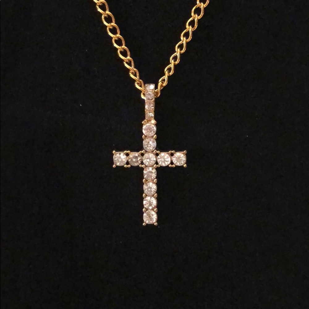 Gold tone cross necklace with simulated diamonds